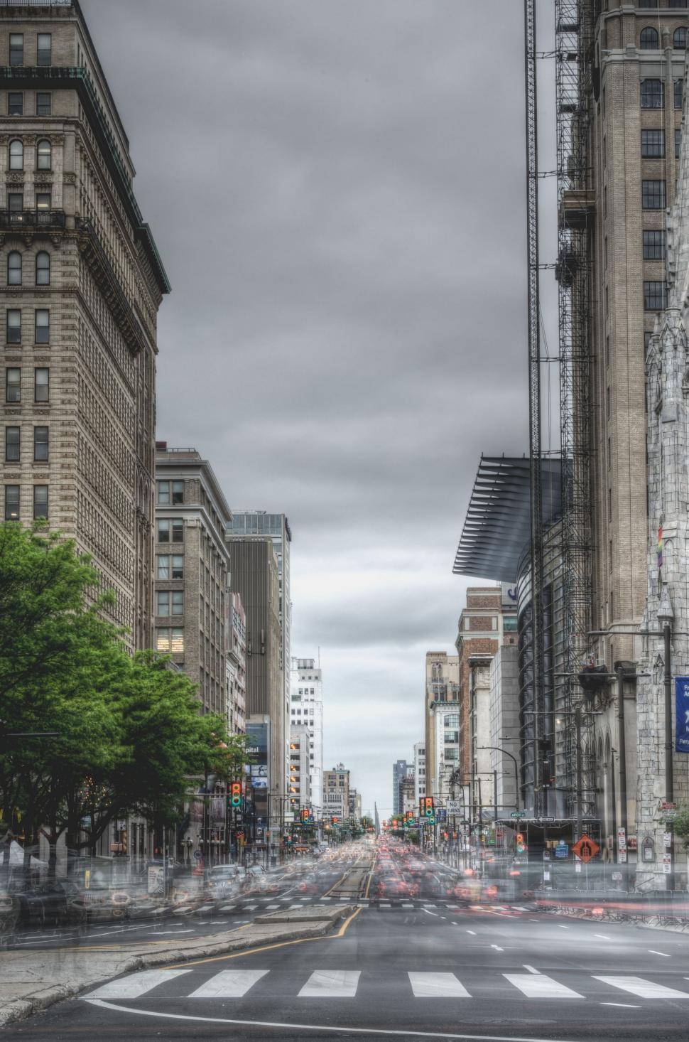 Free Image of Busy City Street With Tall Buildings and Crosswalk 