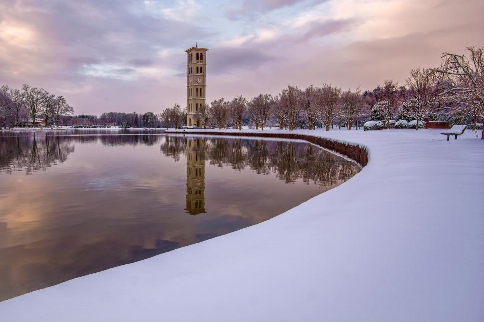 Free Image of Clock Tower Over Snow Covered Lake 