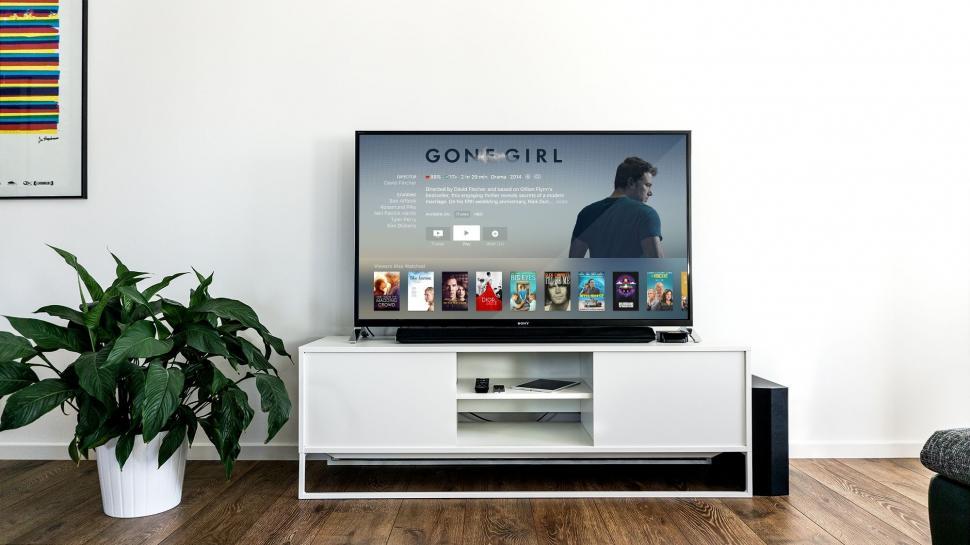 Free Image of Flat Screen TV on White Entertainment Center 