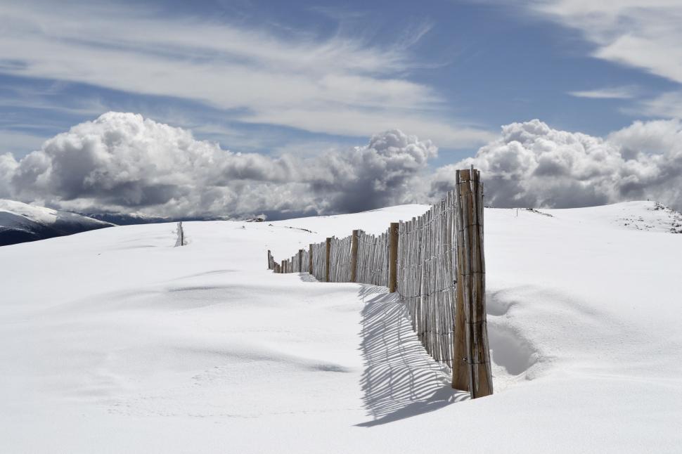 Free Image of Snowy Fence With Clouds 