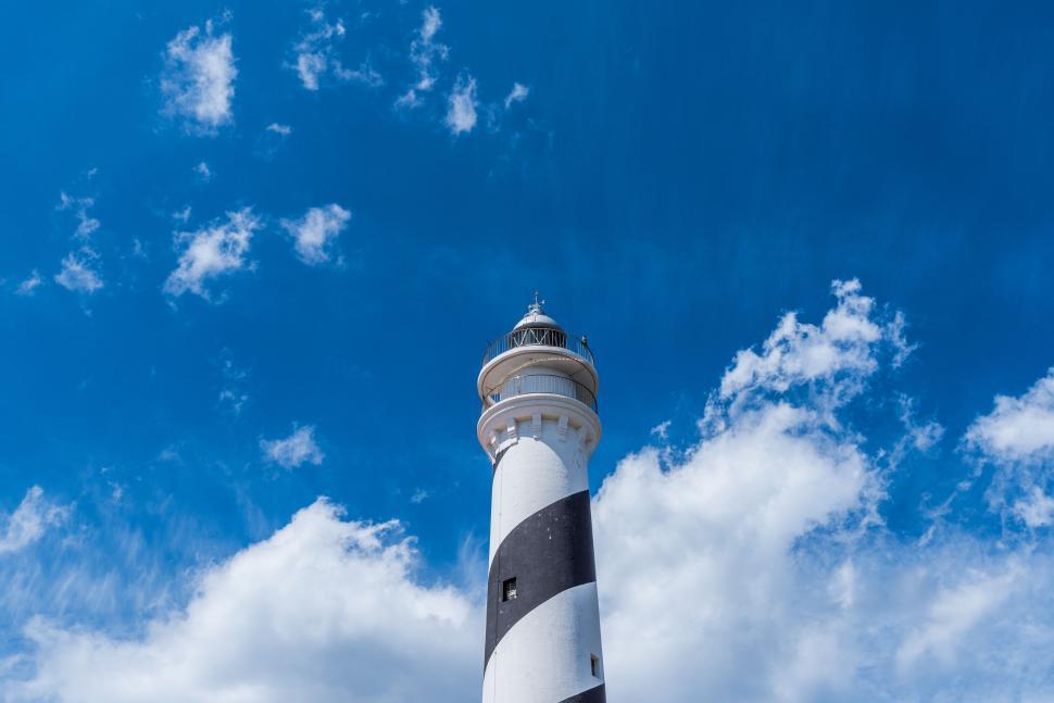 Free Image of Black and White Lighthouse Under Blue Sky 