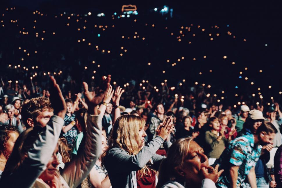 Free Image of Crowd of People Standing Around Each Other at a Concert 