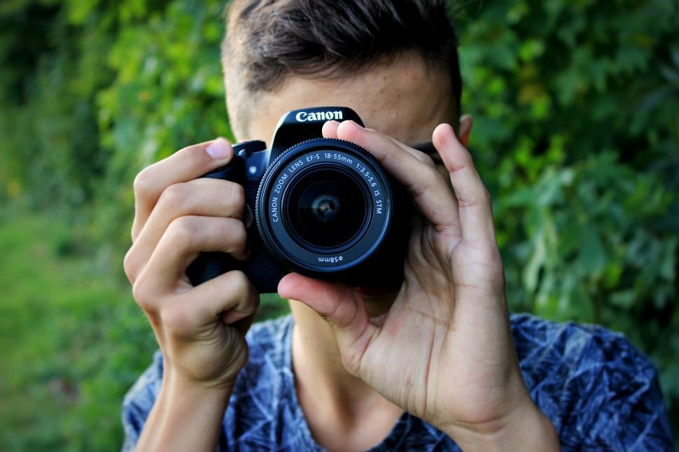 Free Image of Man Holding Camera Up to His Face 