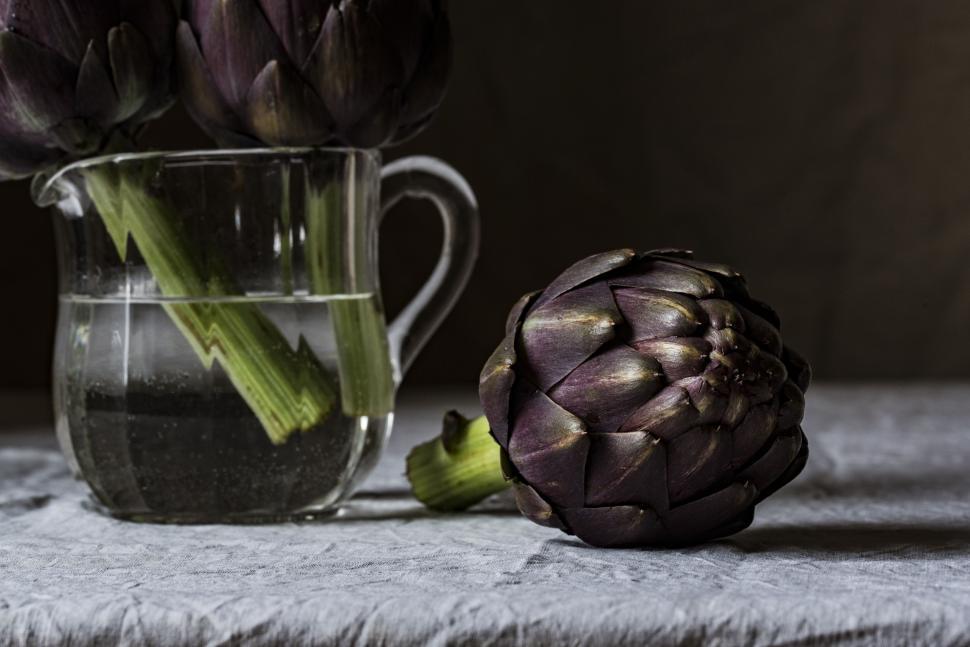 Free Image of Artichoke and Glass of Water on Table 