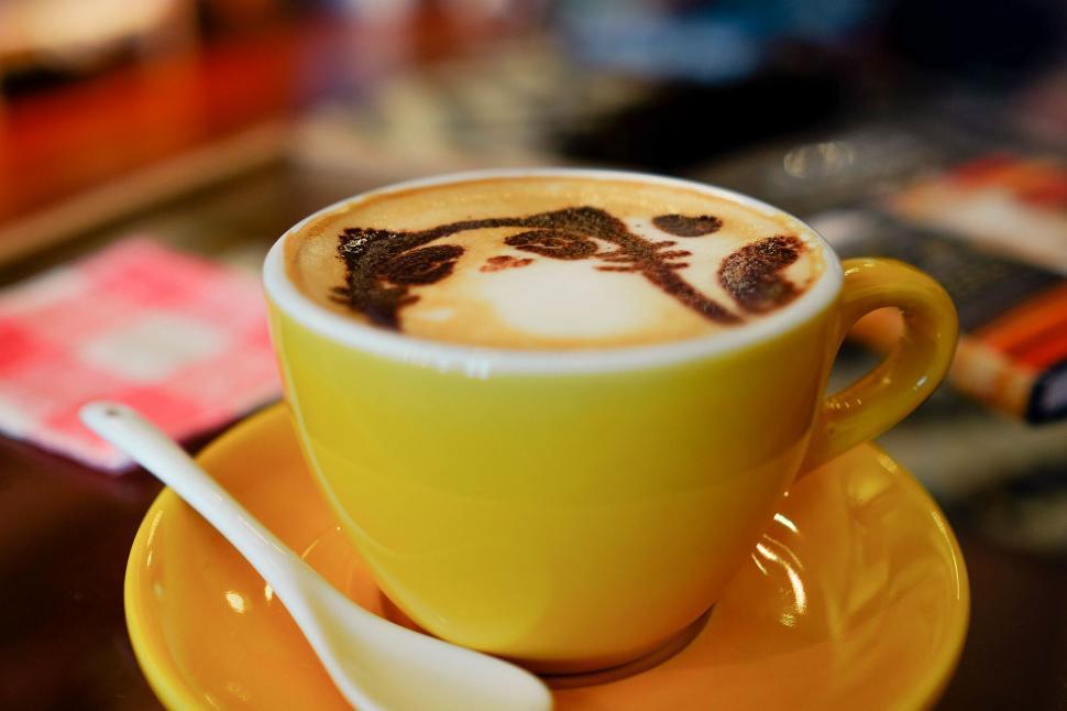 Free Image of A Cup of Cappuccino on a Saucer With Spoon 