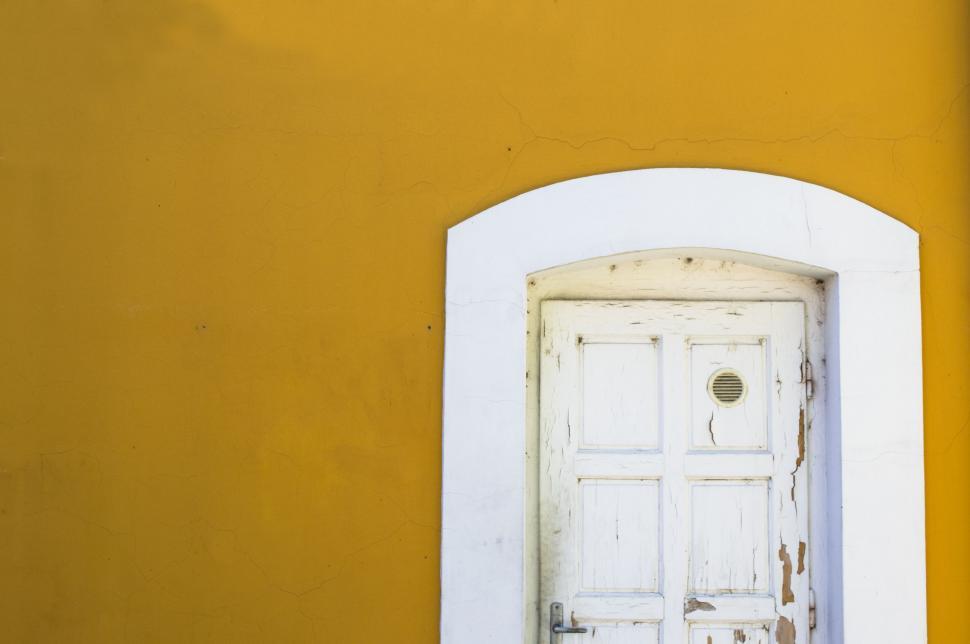 Free Image of White Door With Yellow Wall Background 