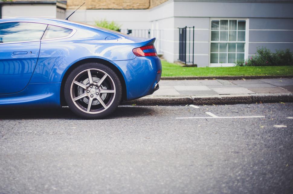 Free Image of Blue Sports Car Parked on Roadside 
