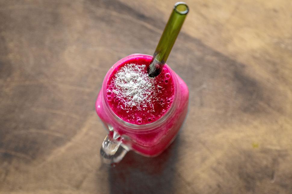 Free Image of Pink Drink With Green Straw 