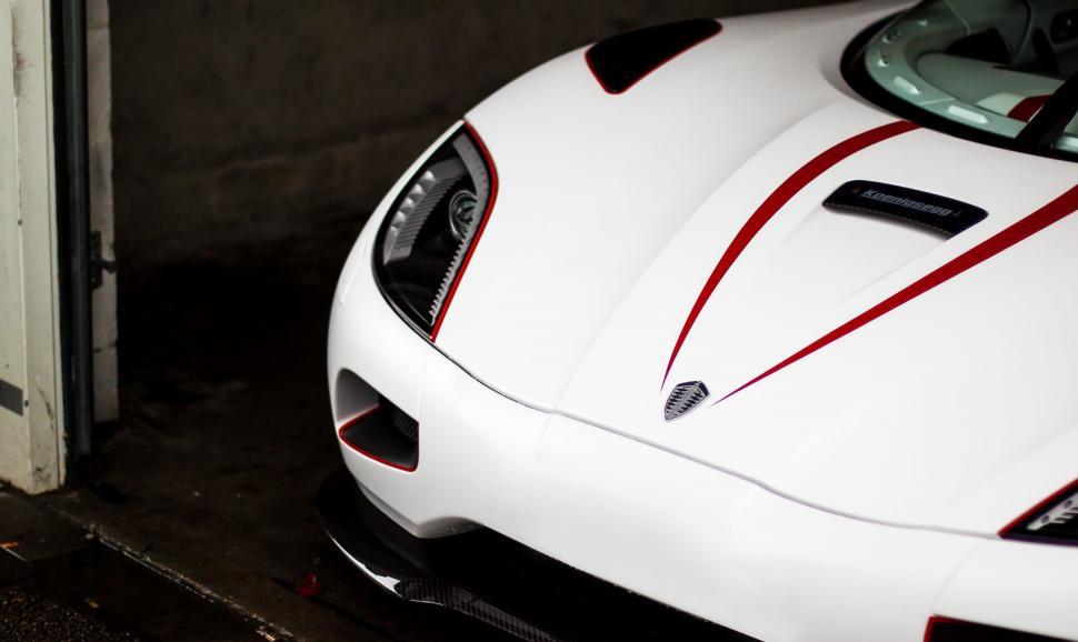 Free Image of White Sports Car Parked in Garage 