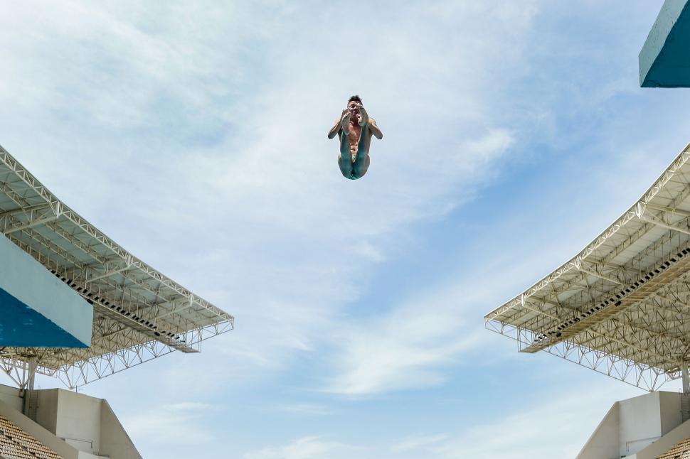 Free Image of Man Performing Airborne Snowboarding Trick 