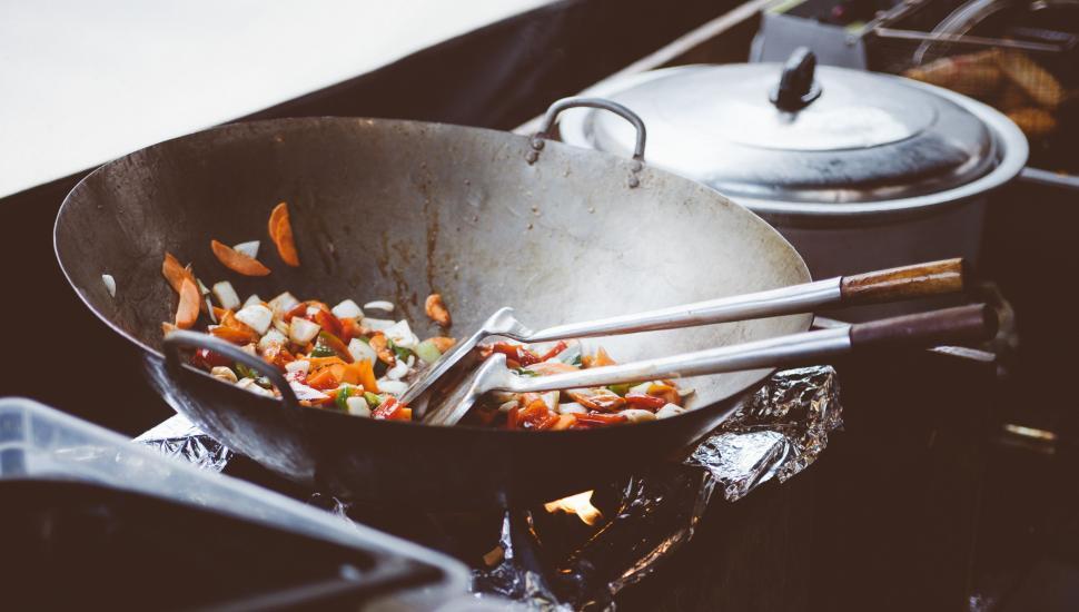 Free Image of A Wok Filled With Food on a Stove 