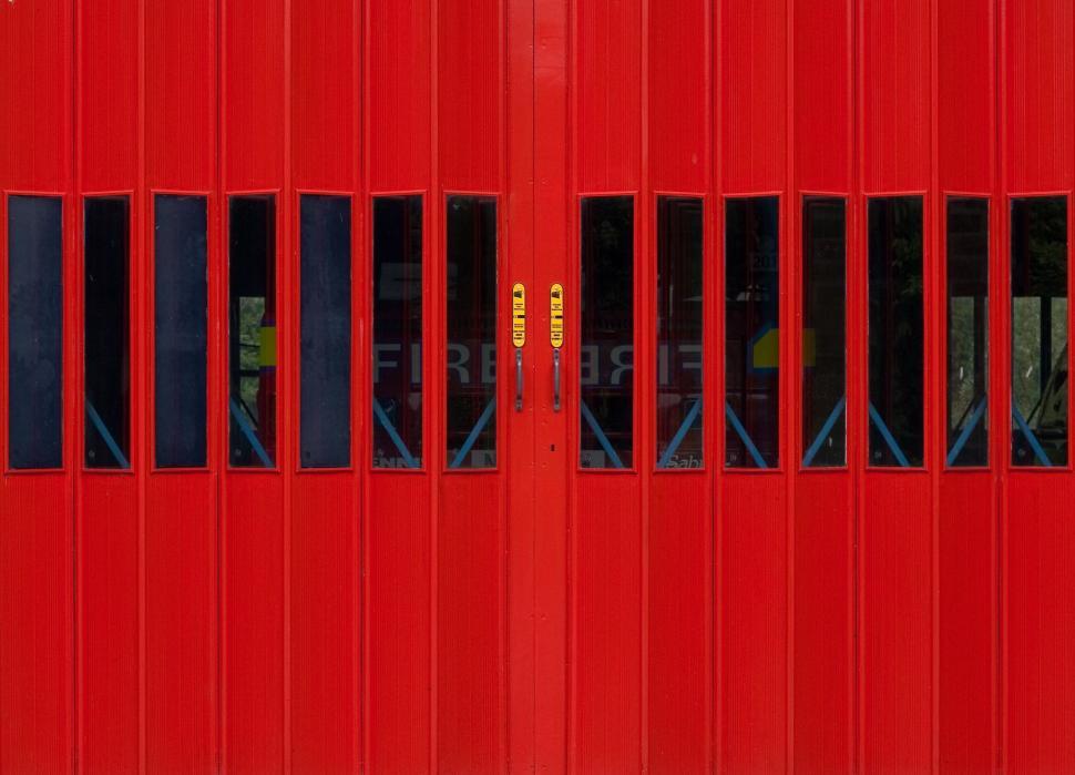 Free Image of Red Door With Side Bars 