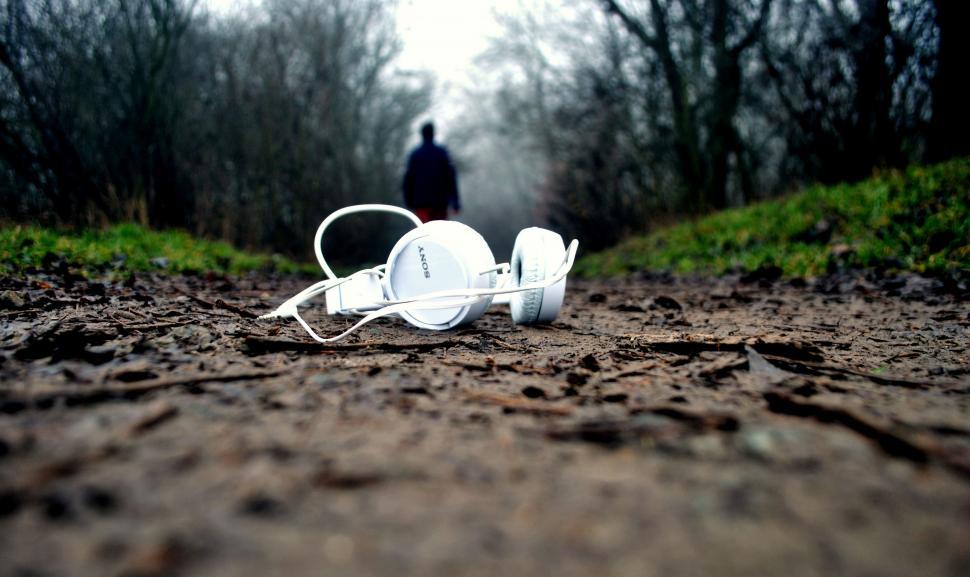 Free Image of Headphones Abandoned on a Dirt Road 