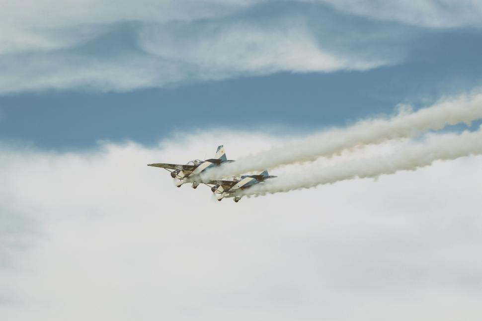 Free Image of Two Jets Flying With Smoke Trails 