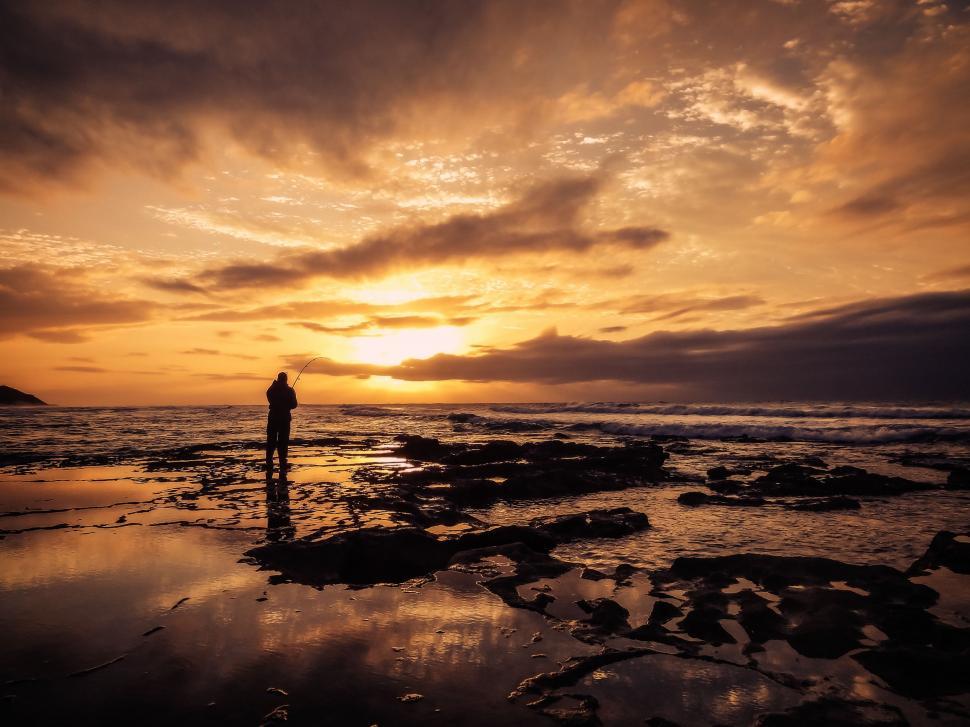 Free Image of Person Watching Sunset on Beach 
