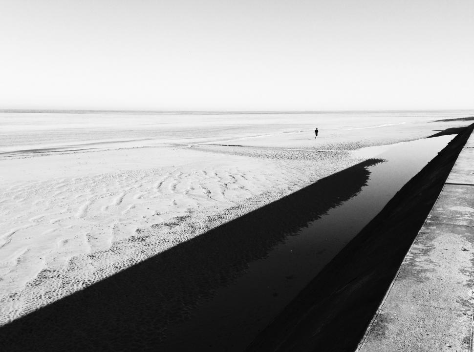 Free Image of Person Walking on Beach 