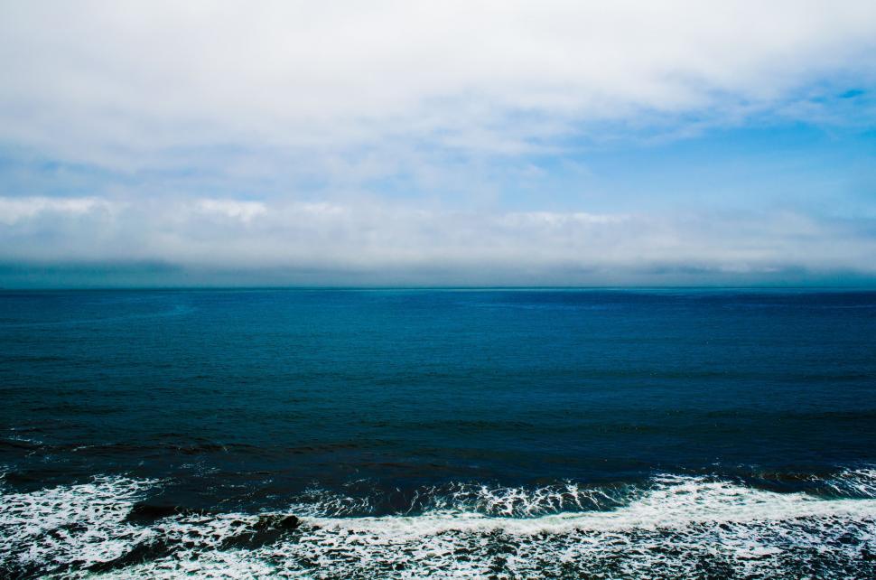 Free Image of Overlooking a Body of Water From Hilltop 