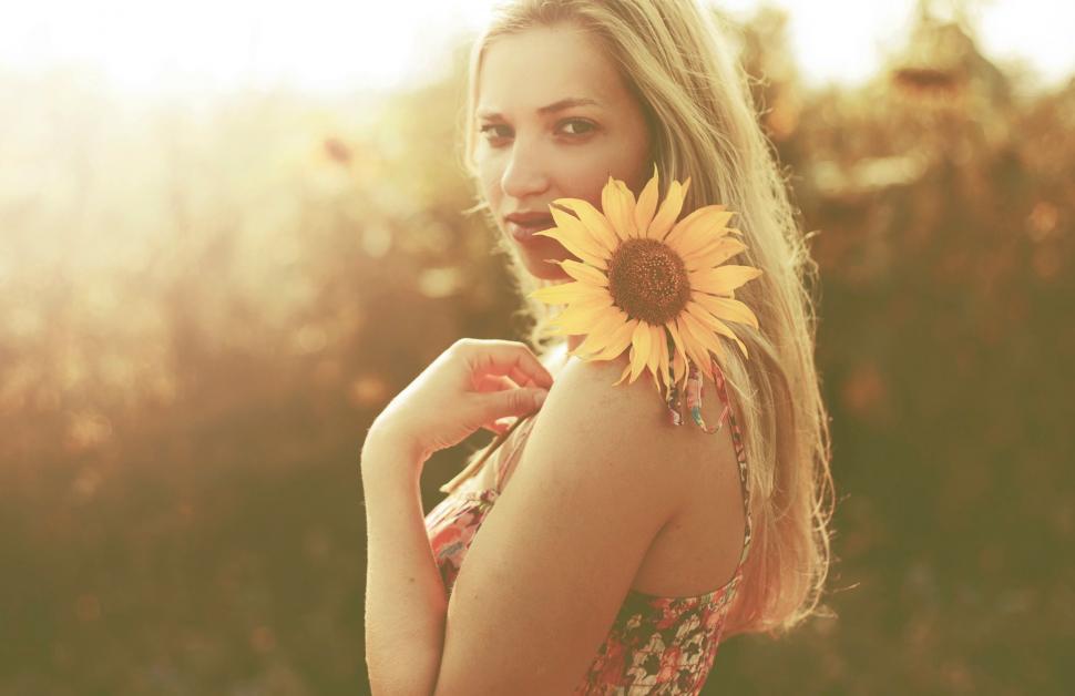 Free Image of Woman Holding Sunflower 