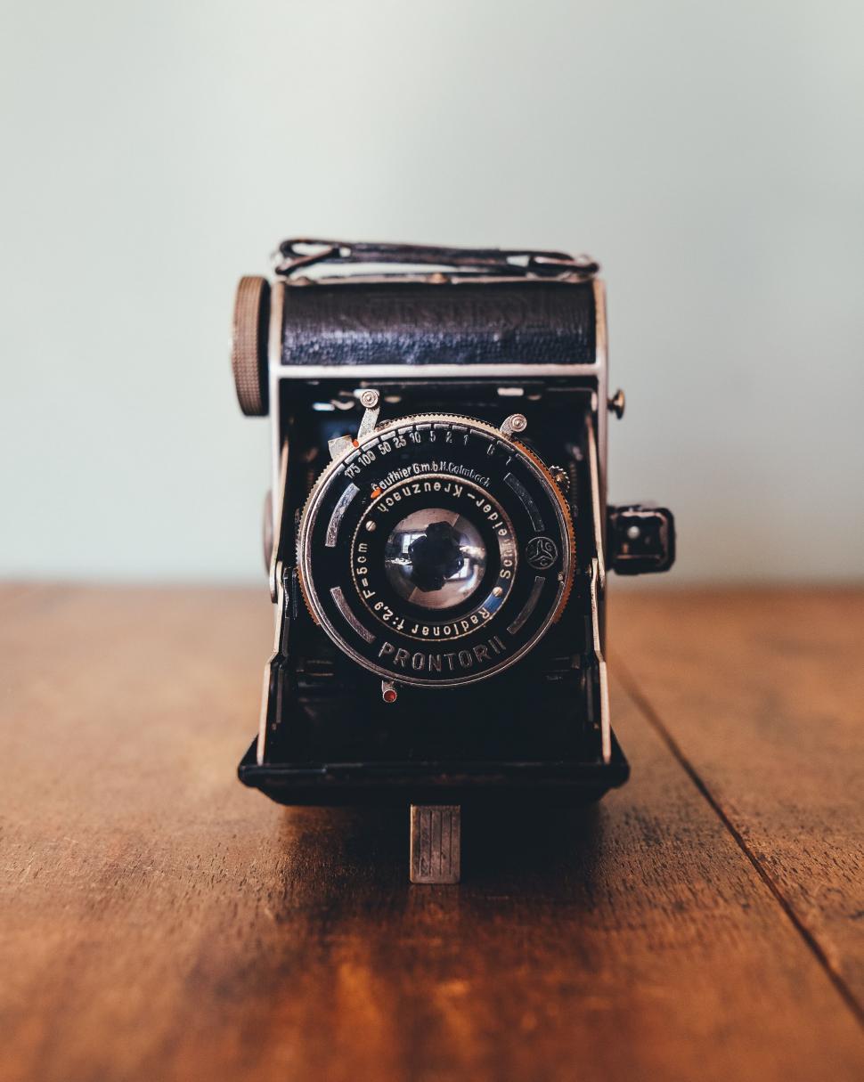 Free Image of Vintage Camera on Wooden Table 