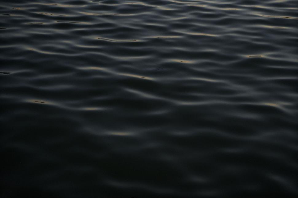 Free Image of Reflections of a Body of Water 