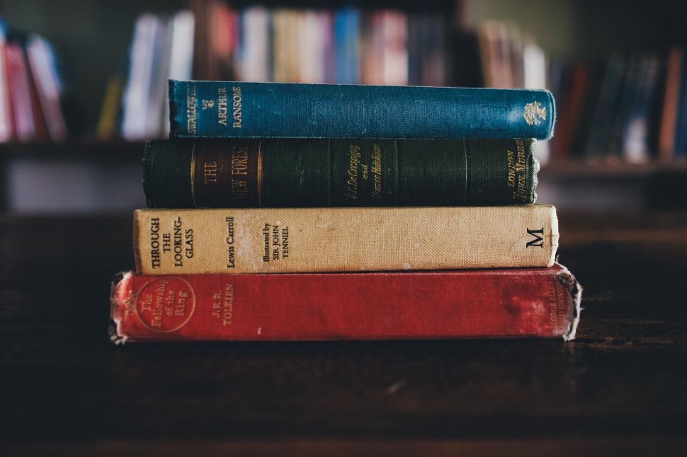 Free Image of Stack of Books on Wooden Table 