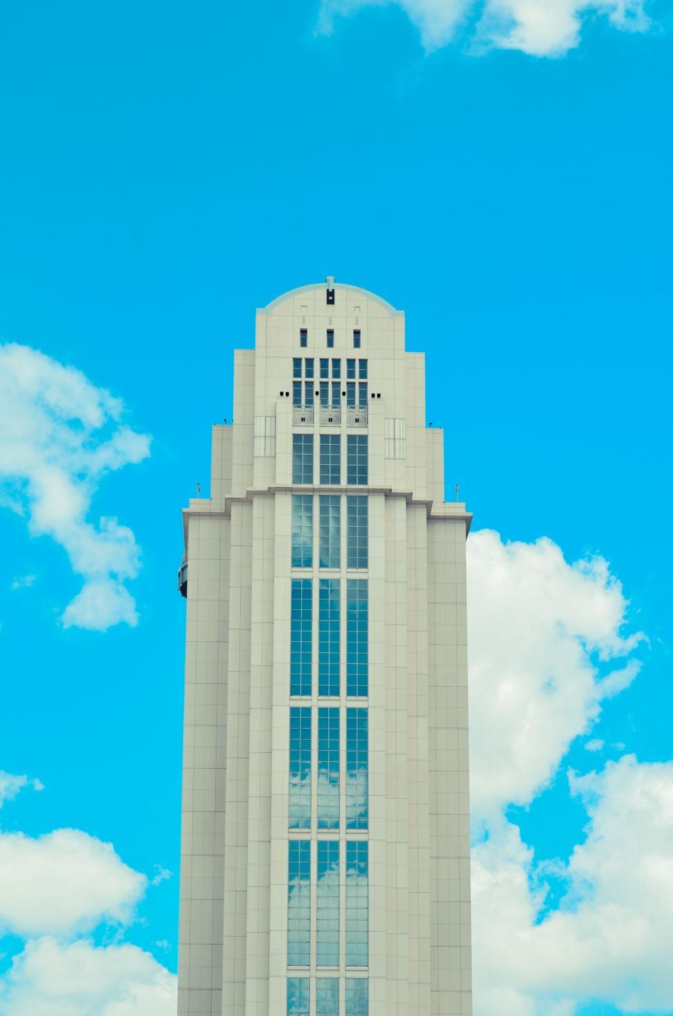 Free Image of Tall Building With Clock At Its Summit 