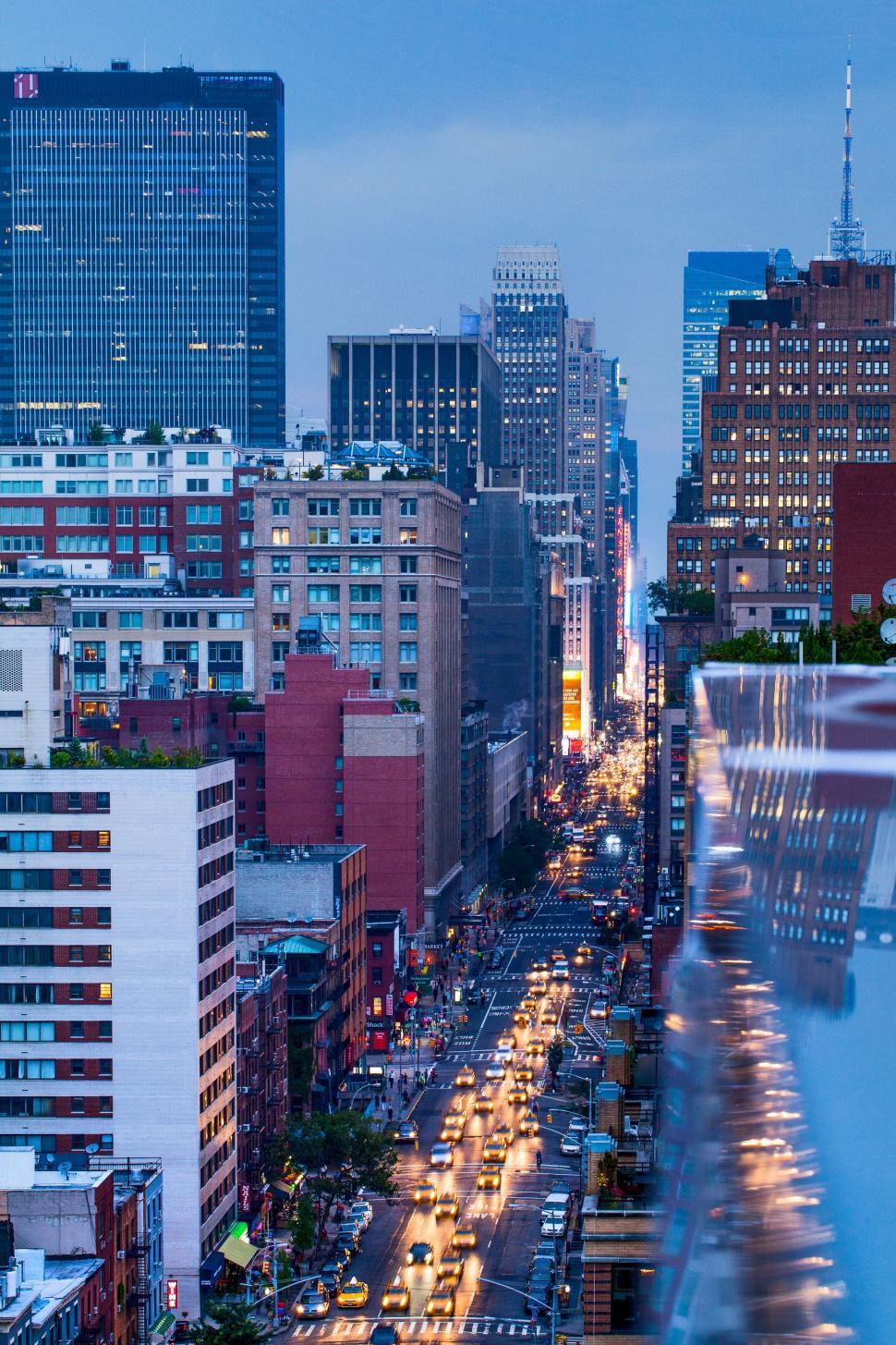 Free Image of Busy City Street With Traffic and Tall Buildings 