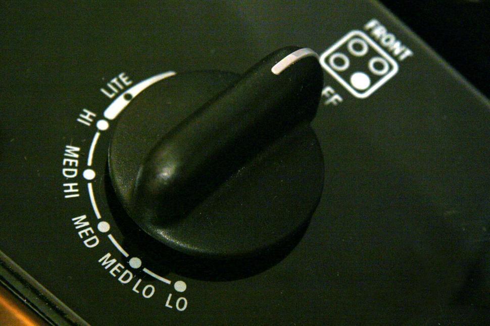 Free Image of Close Up of a Black Knob on a Control Panel 
