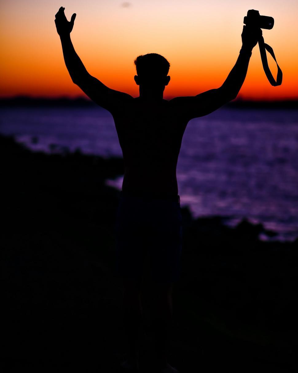 Free Image of Silhouette of Man Holding Scissors 