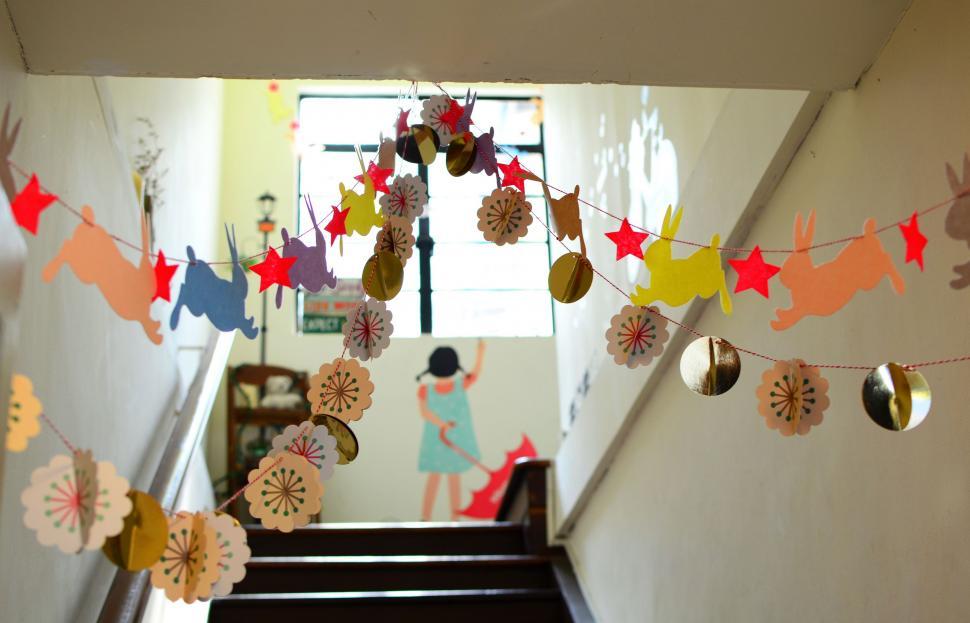Free Image of Staircase Adorned With Paper Fans and Decorations 