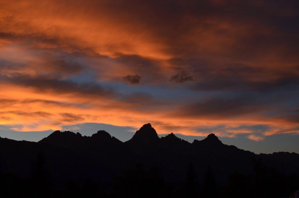 Free Image of Majestic Sunset Over Cloudy Mountains 