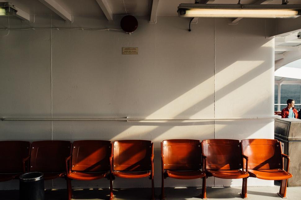 Free Image of Row of Brown Leather Chairs in a Meeting Room 