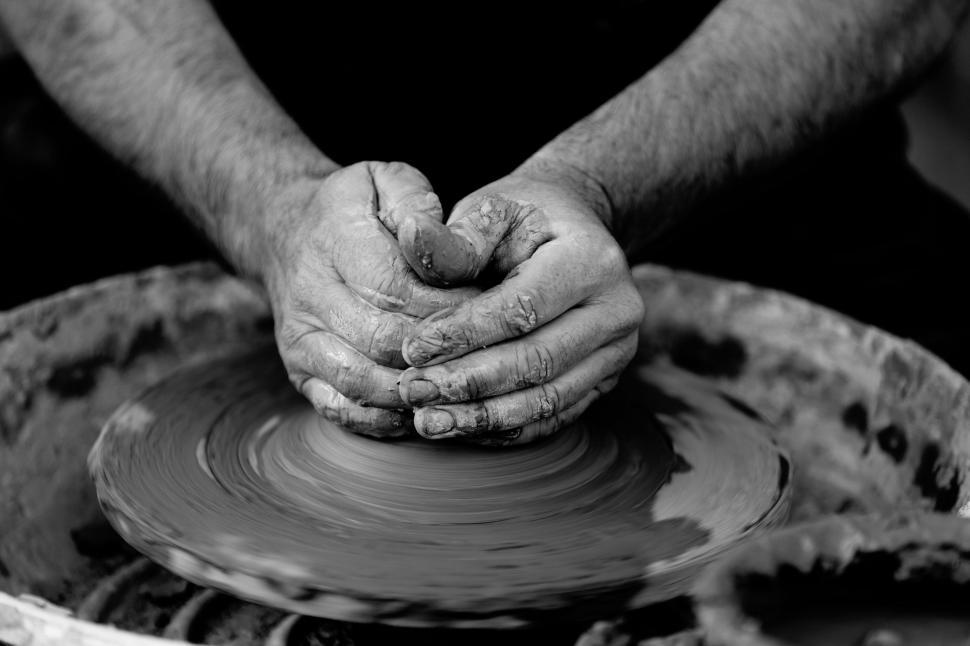 Free Image of Man Creating Pot on Potters Wheel 