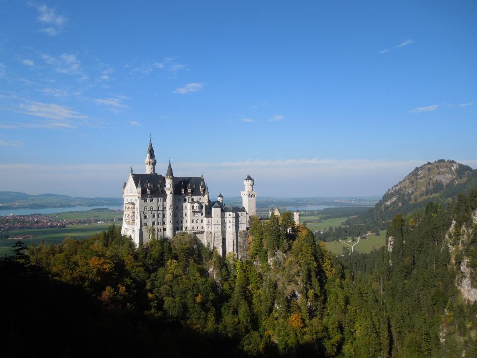 Free Image of Majestic Castle Overlooking Green Hillside 