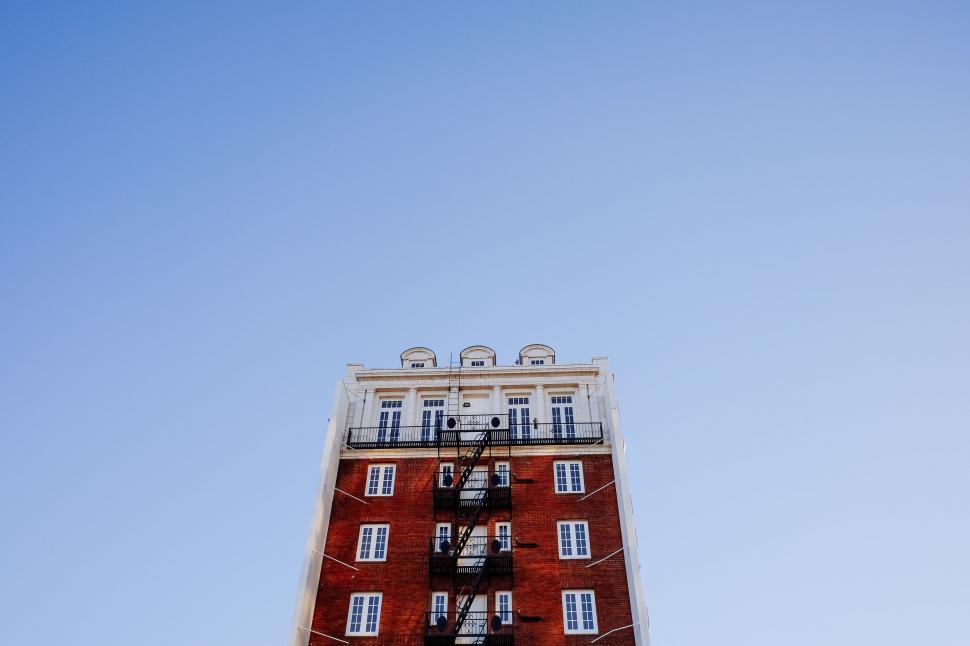 Free Image of Tall Red Building With Balconies 