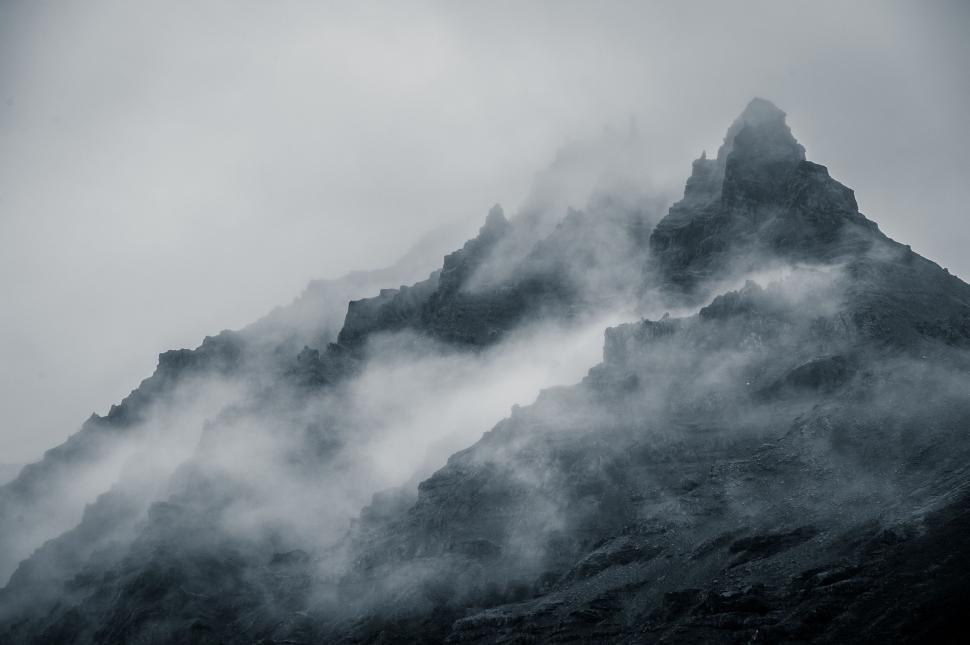 Free Image of Majestic Mountain Shrouded in Fog 