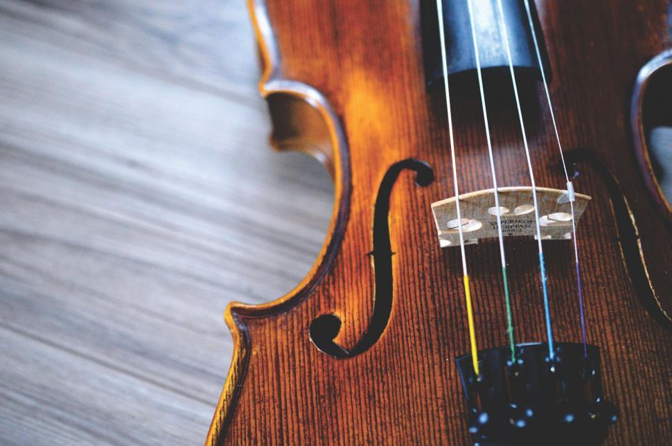 Free Image of Close Up of a Violin on a Wooden Floor 