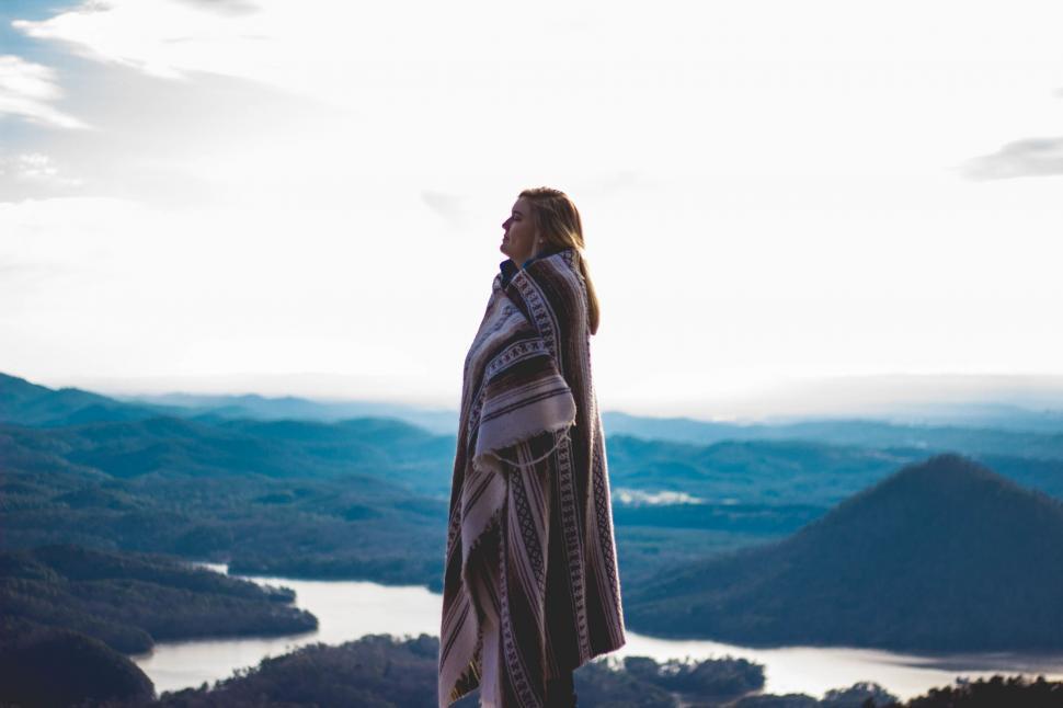 Free Image of Person Standing on Mountain Top With Blanket 