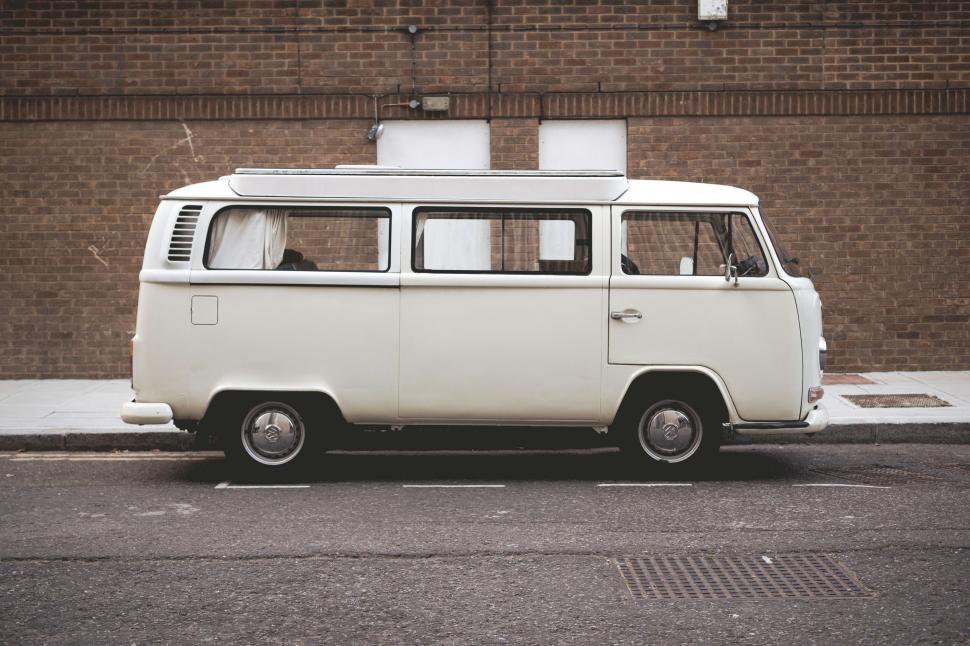 Free Image of White Van Parked on Side of Road 