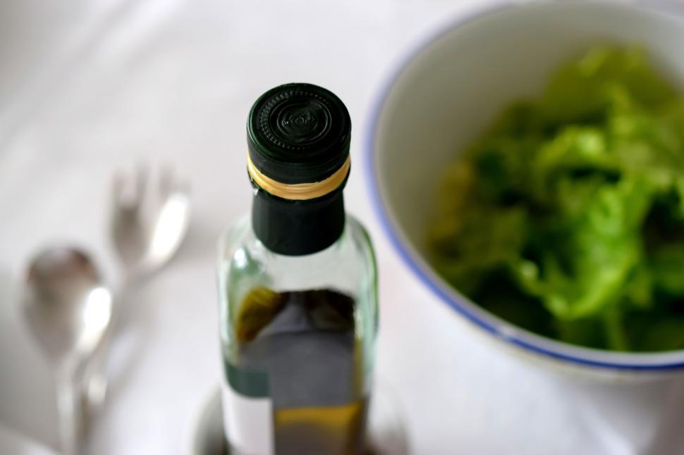 Free Image of Bowl of Lettuce and Wine Bottle 