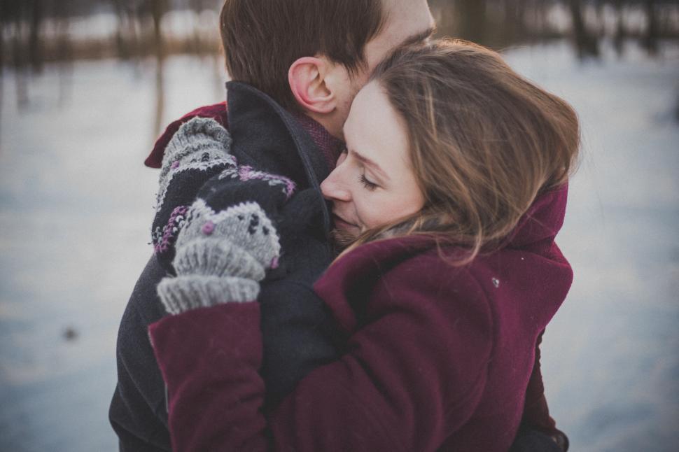Free Image of Man and Woman Hugging in the Snow 