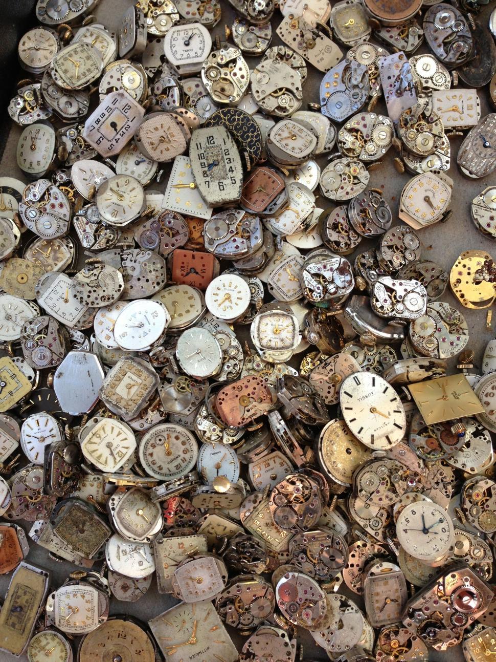 Free Image of A Pile of Old Clocks on a Table 