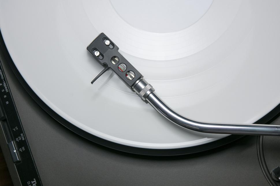 Free Image of White Record Player With Black Handle 