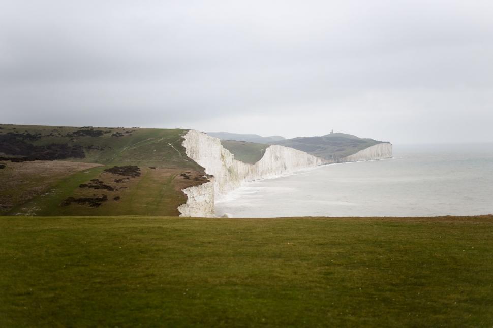 Free Image of Grassy Field With White Cliff 