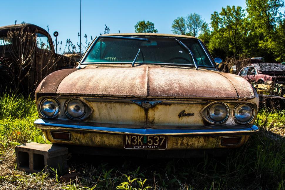 Free Image of Abandoned Rusty Car in Grass 