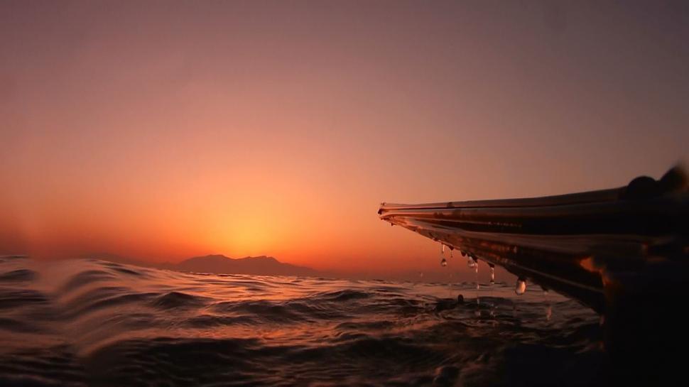 Free Image of Boat Sailing Into Sunset 