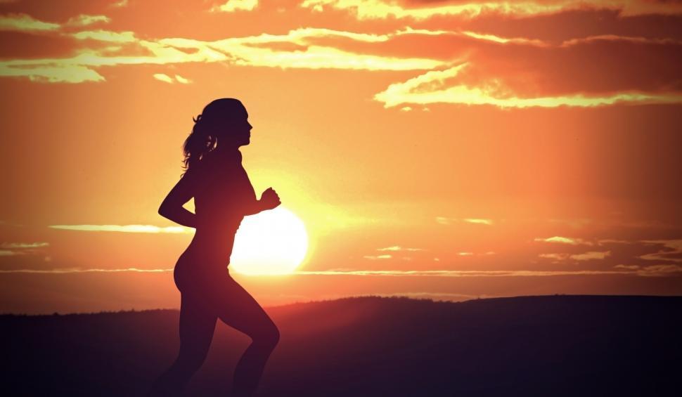 Download Free Stock Photo of Young Woman Jogging at Sunset - Fitness and Health 
