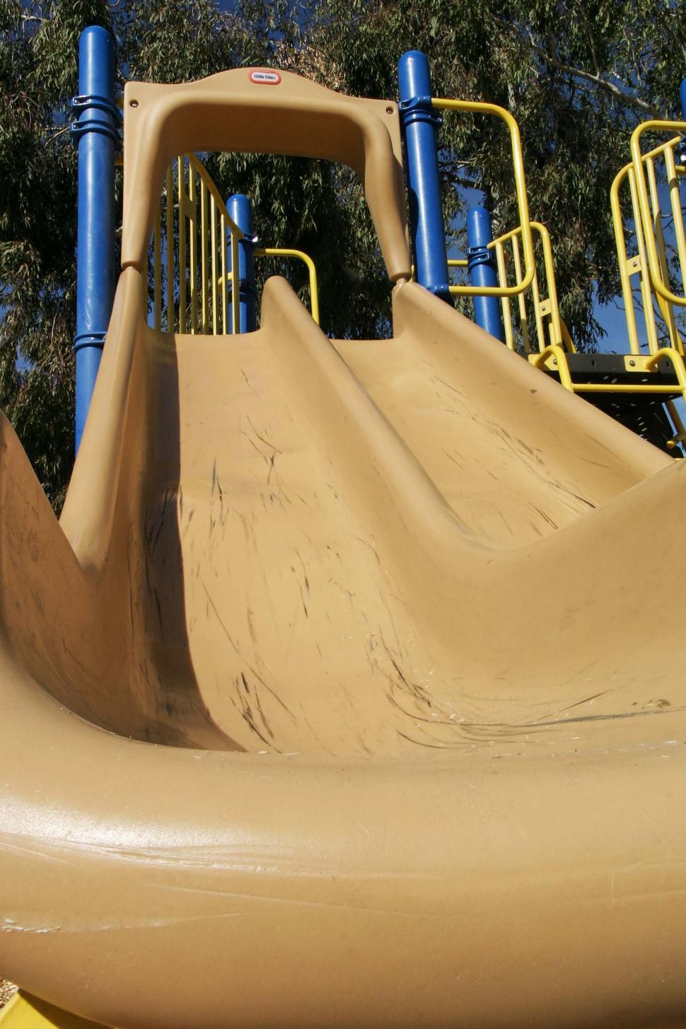 Free Image of Large Slide in Playground With Trees Background 