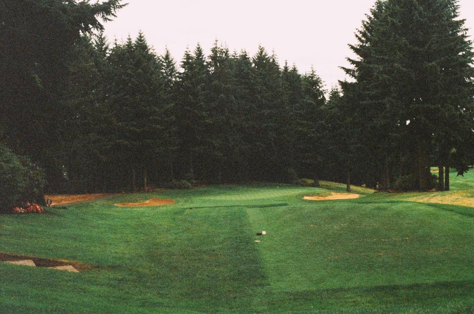 Free Image of Green Golf Course With Trees in Background 