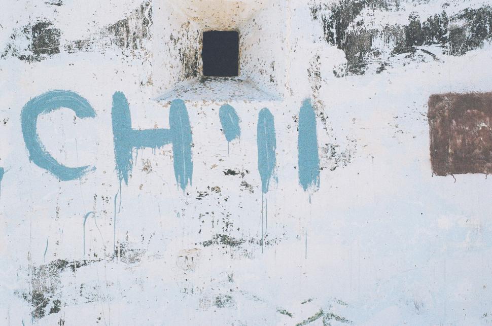 Free Image of White Building With Blue Writing 